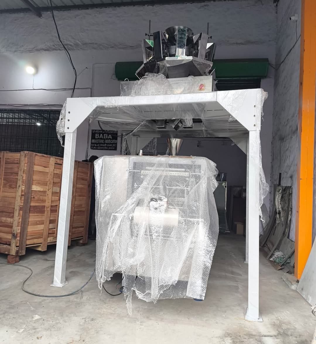 A multihead weigher packing machine wrapped for dispatch at the Baba Industrial Fabrication works